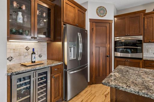 Designed with both beauty and function in mind. Enjoy stainless steel appliances, a built-in wine refrigerator, display cabinetry, generous pantry, granite countertops, and extensive cabinet storage.