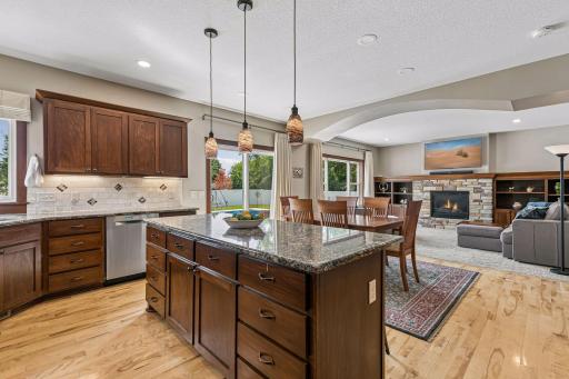Open-concept living at its best. The spacious kitchen flows into the informal dining area and inviting family room, creating an ideal layout for entertaining and everyday family life.