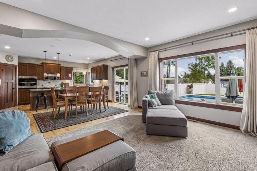 Take notice of the architectural ceiling soffit, which creates a subtle visual separation between the great room and dining area.