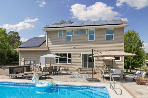 Multiple seating areas, generous patio space, and a professionally landscaped setting provide endless opportunities to entertain or simply relax.