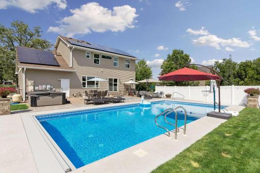 Built for making memories. The expansive heated saltwater pool, spacious patios, and large fenced yard create the perfect backdrop for fun all summer long. Owned solar panels also help improve energy efficiency while reducing utility costs.