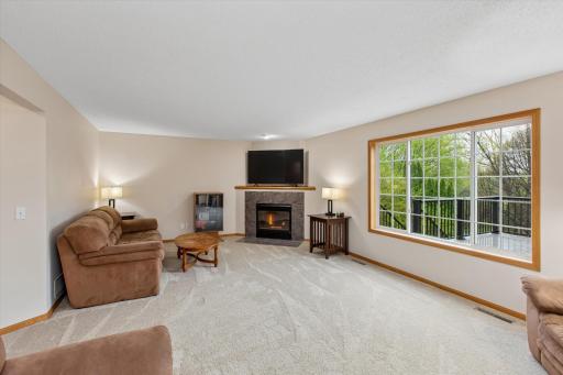 Big windows and fireplace in family room make this space perfect