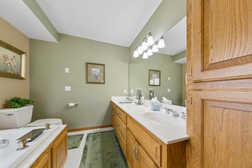 Primary bathroom with double sinks and jacuzzi tub
