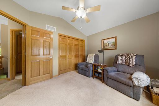 Large closet in secondary bedroom showcases solid core doors