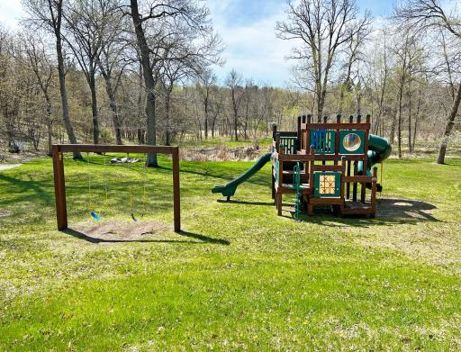 This play ground area is a common area owned by the HOA and is just down the street a short walk from the lot.