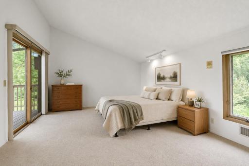 The primary bedroom features an ensuite bathroom, walk in closet and your own private balcony to enjoy your morning coffee. This room has been virtually staged.