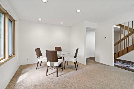 Formal dining room off of the kitchen offer plenty of natural lighting.