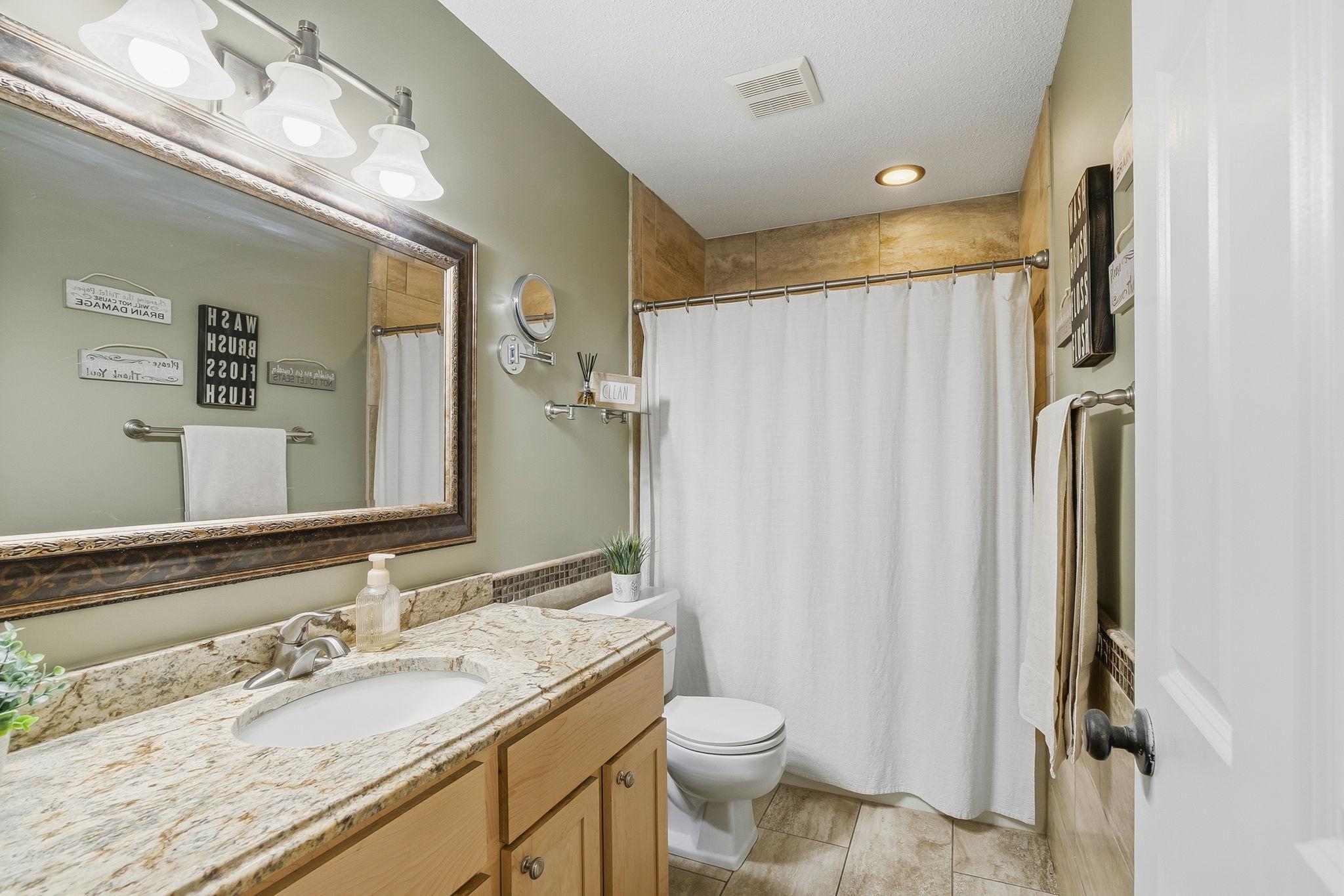 Updated full bathroom on the upper level.