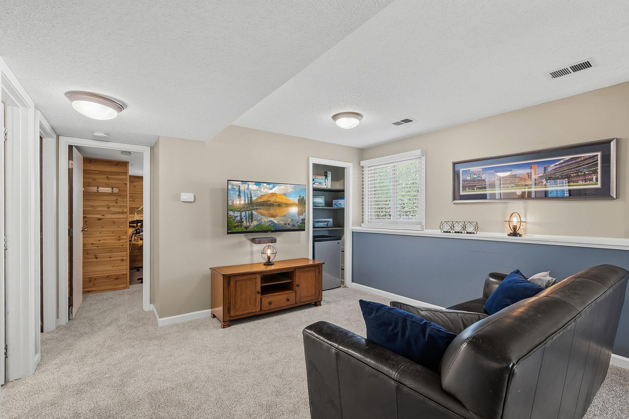 Lower level completed with new carpet and look out windows.