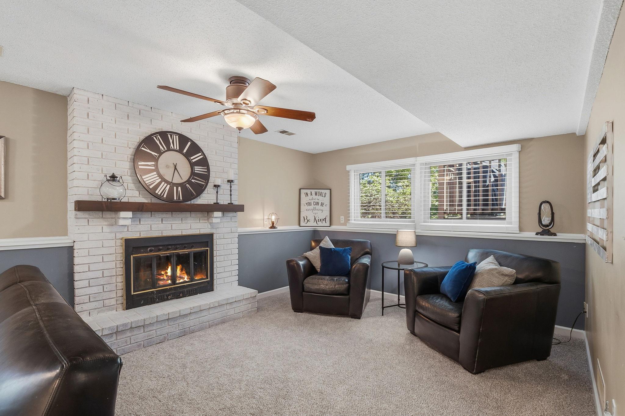 Lower level with wood burning fireplace.