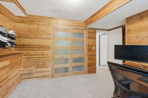 Lower level room currently set up as an office space.