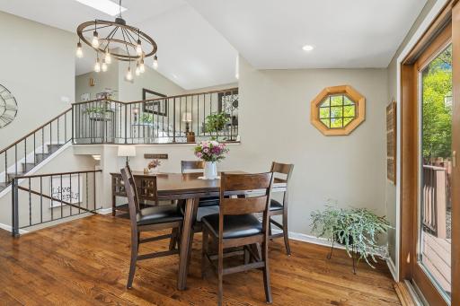 Dining area on the main level and gorgeous wood flooring..