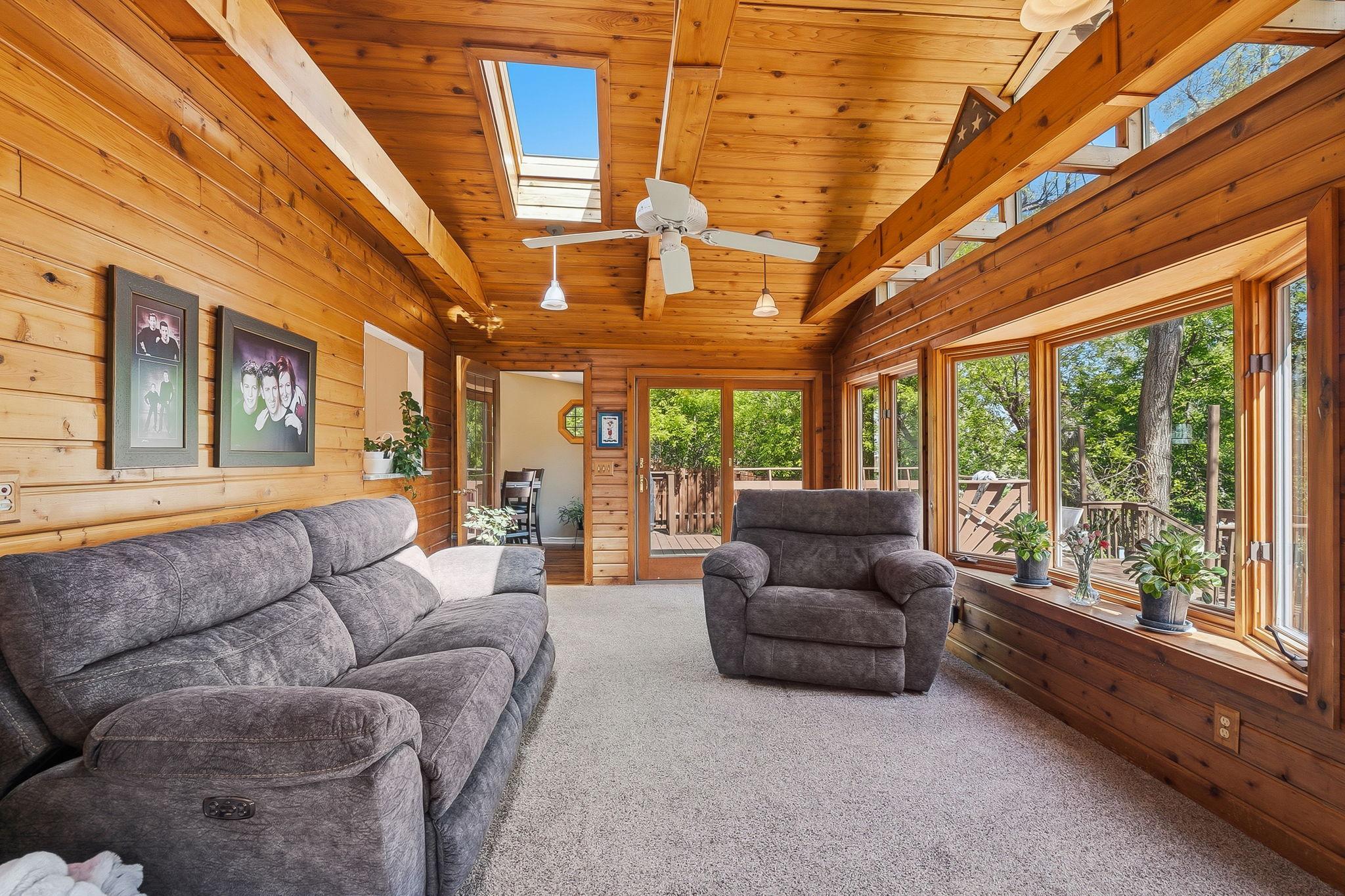 Four season porch with panoramic views of the lake.