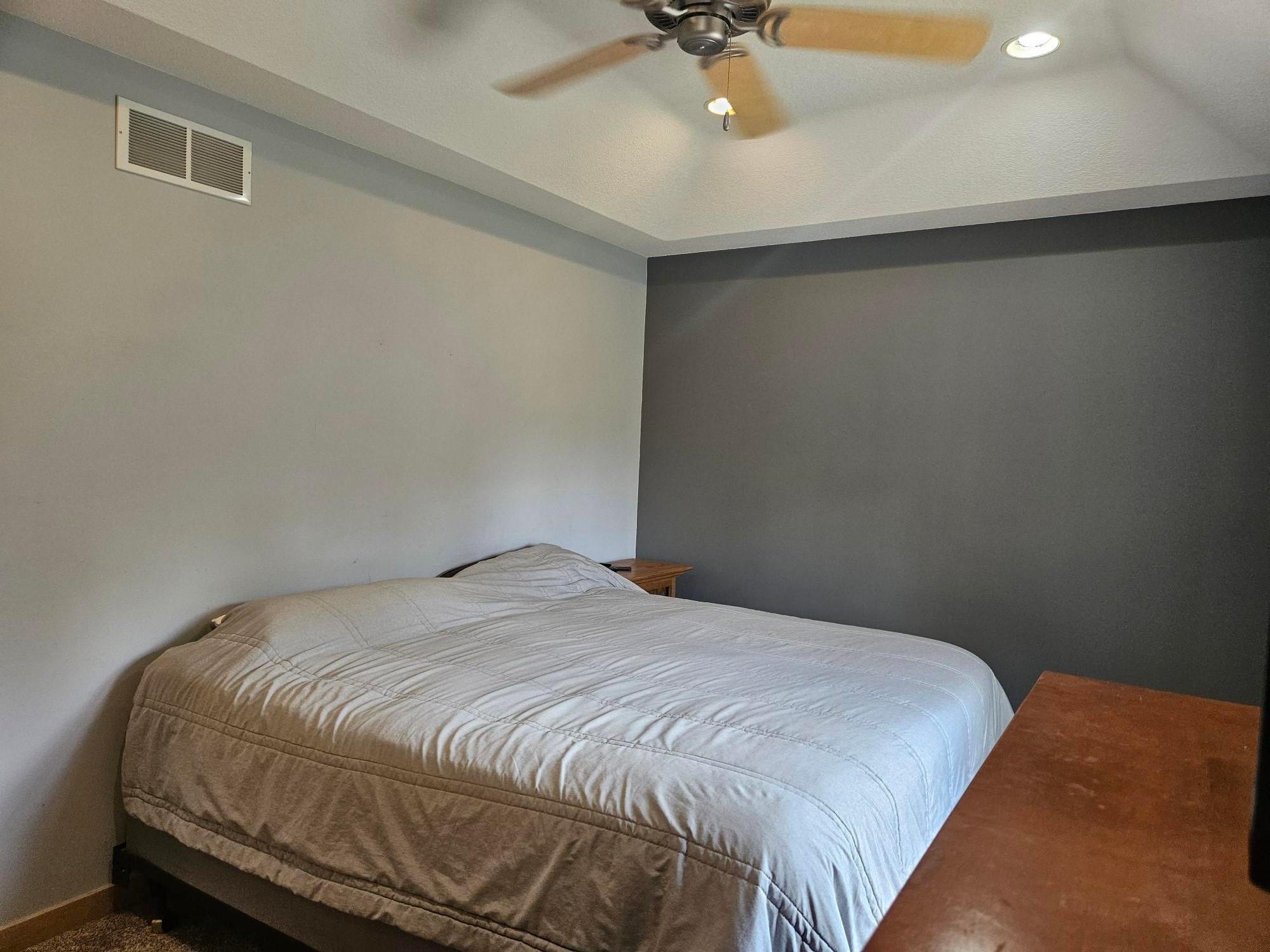 Large Owner's Bedroom w/ceiling fan tucked into a pan vaulted ceiling