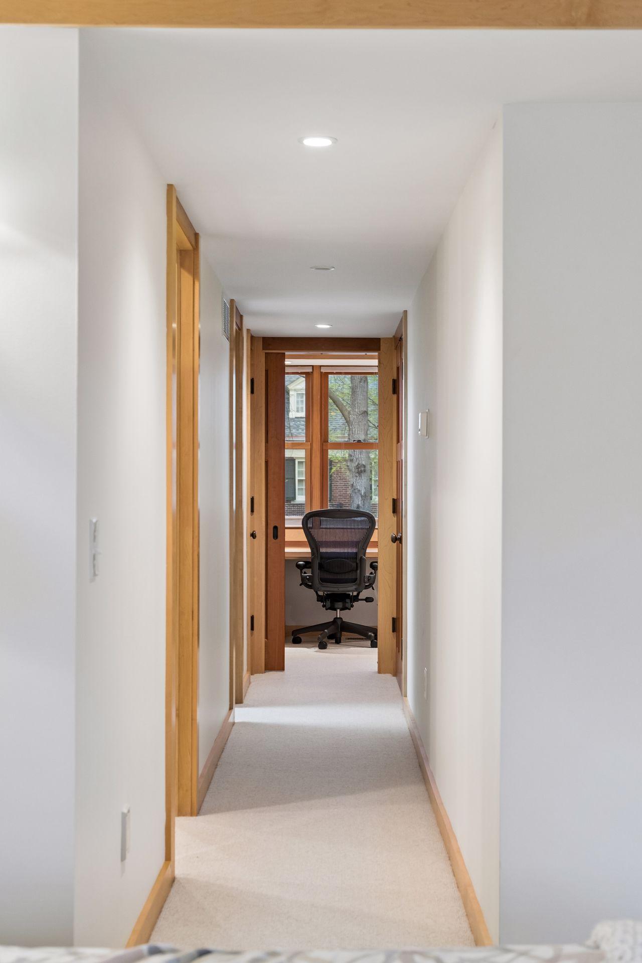 Primary suite hall to bath, closets and office