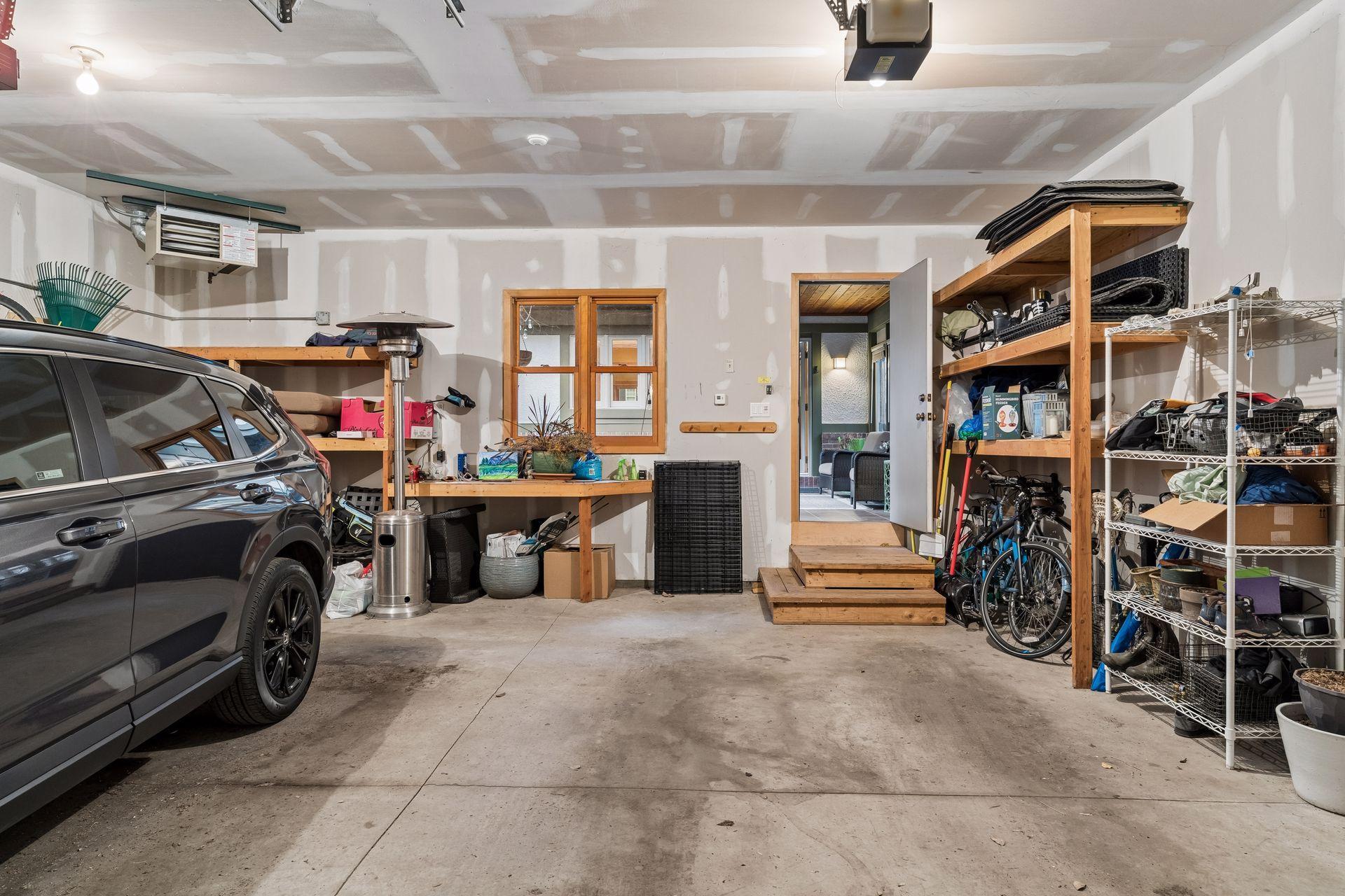 Large attached 2 car garage enters home through the Breezeway