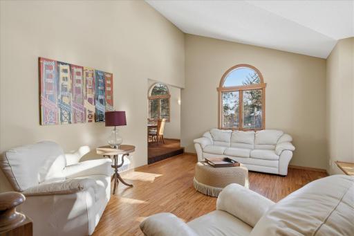 Living Room w/beautiful wood flooring and open to both Entry and Formal Dining Room