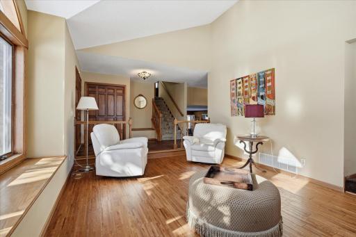 Inviting Entry w/custom wood flooring, large closet and sitting bench