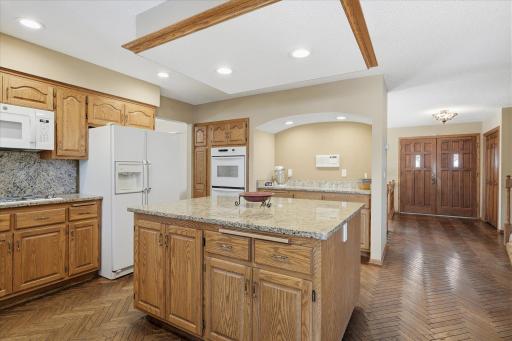 Open Kitchen features: big center island w/granite counter top w/lower cabinets, granite counter tops and backsplash, gas cooktop range, double ovens, Butler pantry are w/granite top + LED recessed lights, custom wood floors and LED recessed light