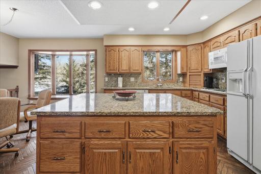 Beautiful granite counter tops and backsplash along with recessed lighting.
Numerous pullouts under Kitchen Island and other cabinets