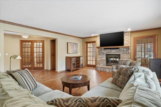 Walkout Family Room opens to 3rd Bedroom/Office and Sun Room areas with French Doors
