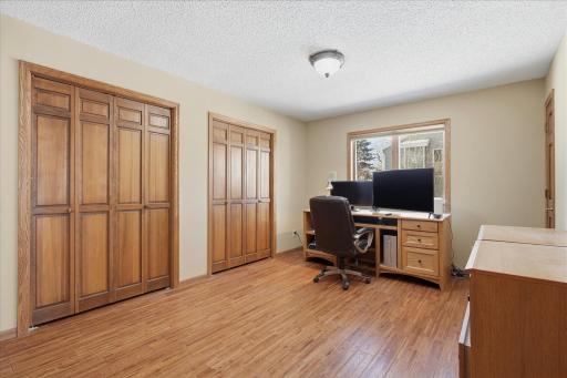 Main Level 3rd Bedroom/Office w/hardwood flooring, French double doors and two closets