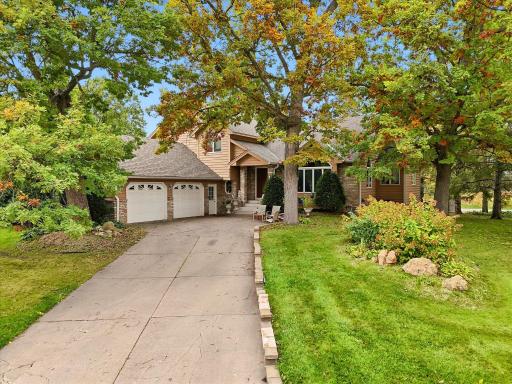Great curb appeal exterior w/mature trees for added privacy. Inviting front entry porch with brick accents. Concrete driveway with plenty of parking