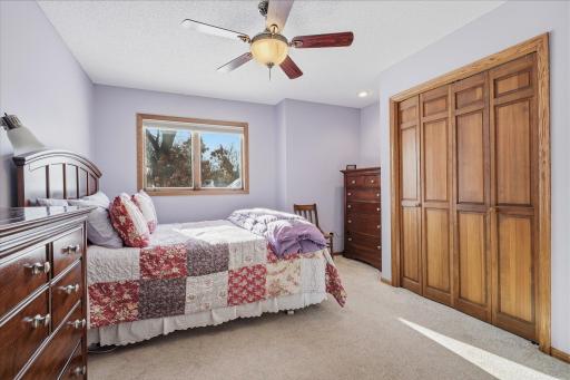 Upper Level 2nd Bedroom with ceiling fan/light, large closet and window
