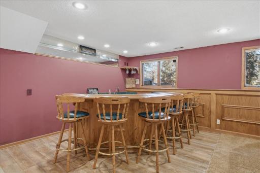 Custom wet bar area with tile wood like flooring