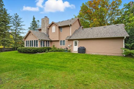 Partial wood privacy fenced level backyard on .43 acre lot. Irrigation sprinkler system. Great space for kids/pets