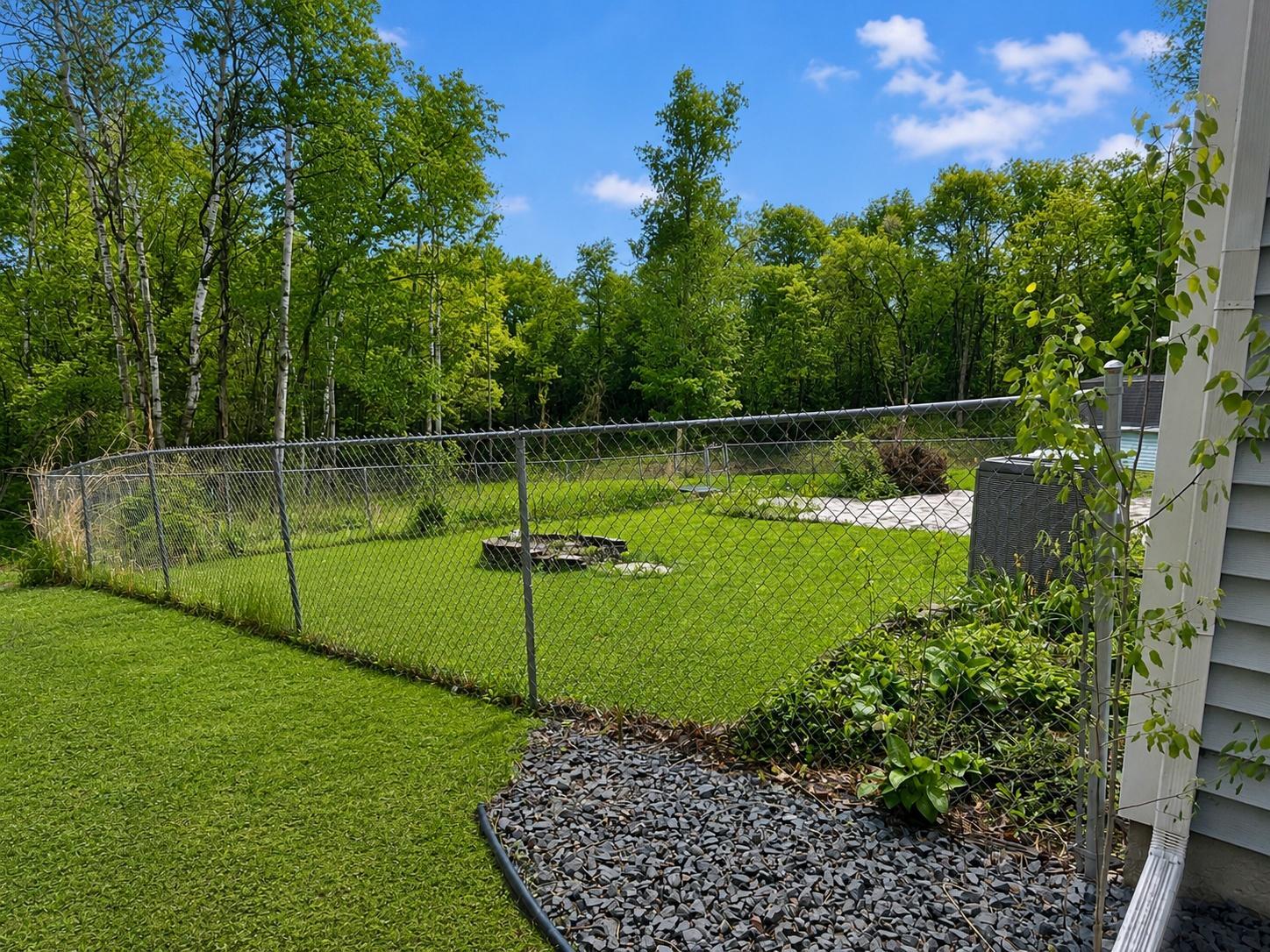 Spacious fenced yard offers room to play, garden, or simply enjoy the outdoors.
