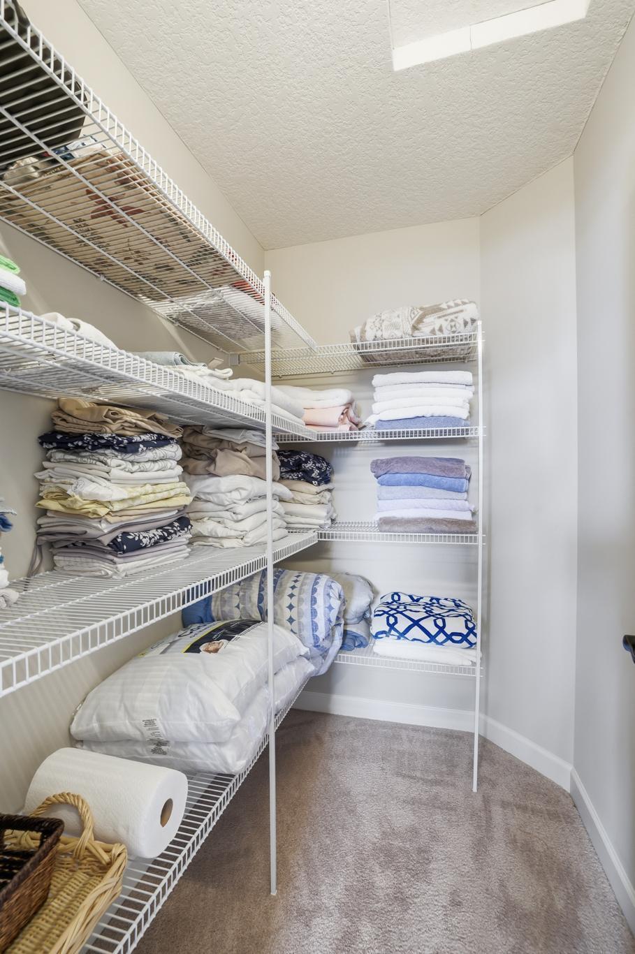 Upstairs walk-in linen closet, this home scores and A+ on storage space!