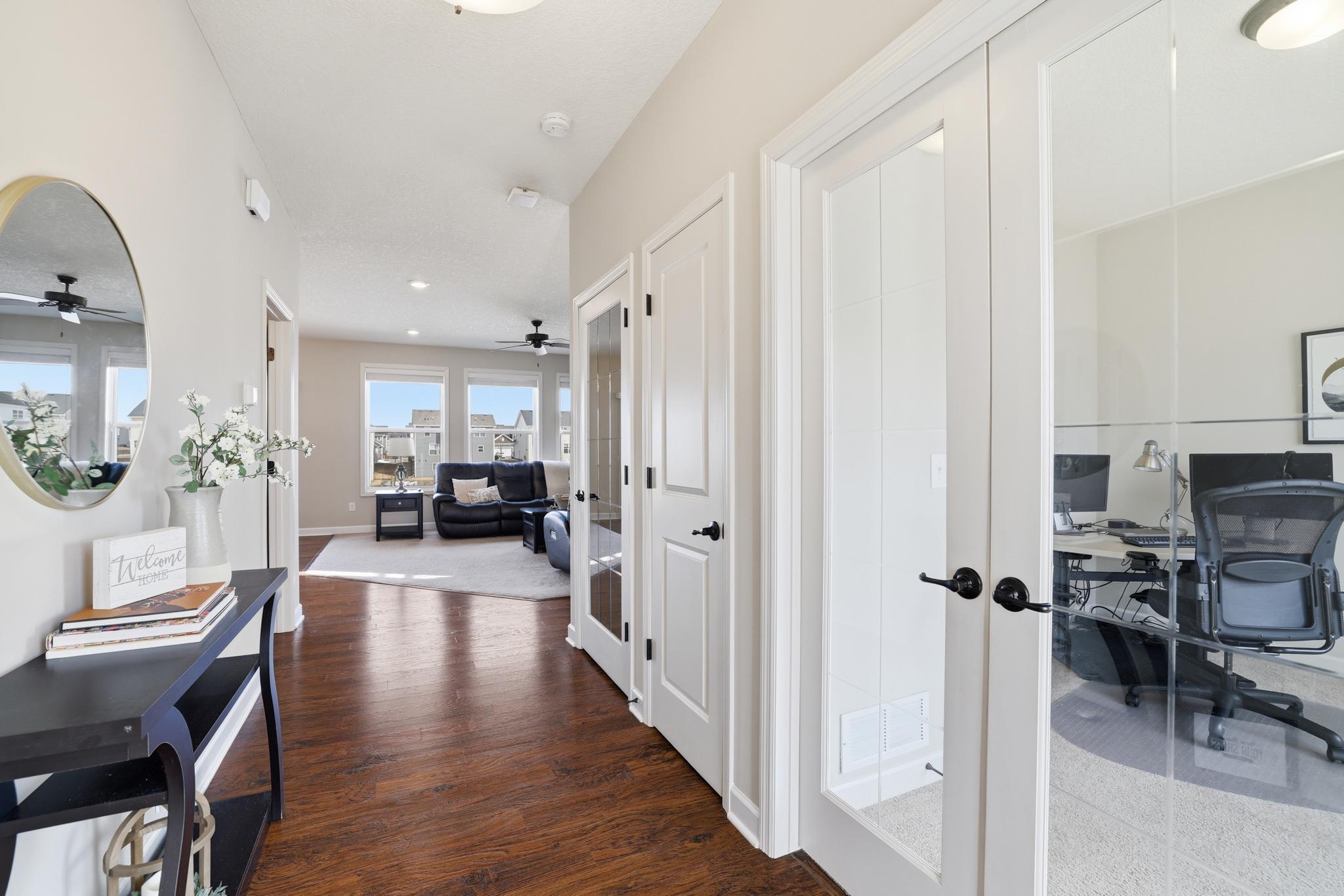 French doors open to a spacious office.