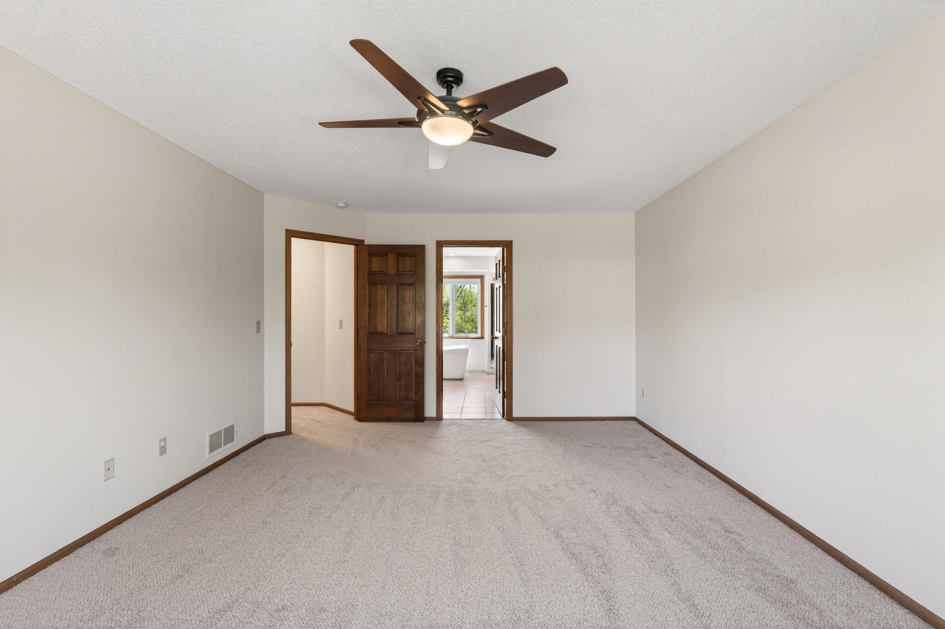 Primary bedroom features a private, full bathroom.