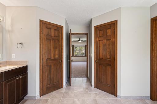 "His and Hers" closets in the primary bathroom.