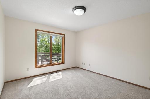 Window in the formal dining looks out to the backyard and deck.