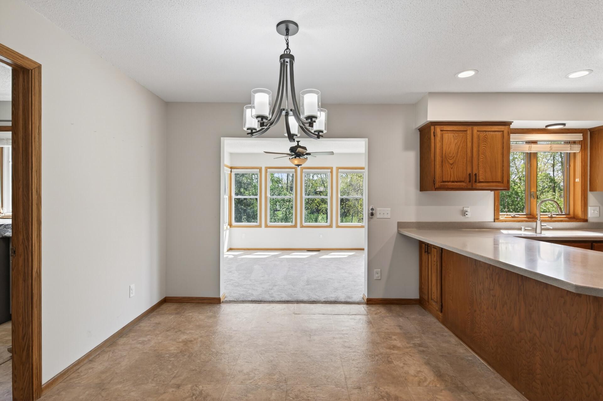 Dining space off of the kitchen leads to 4-season porch.