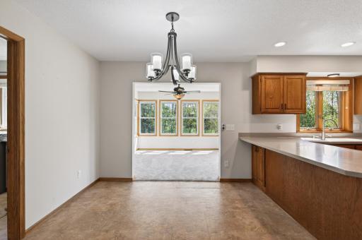 Dining space off of the kitchen leads to 4-season porch.