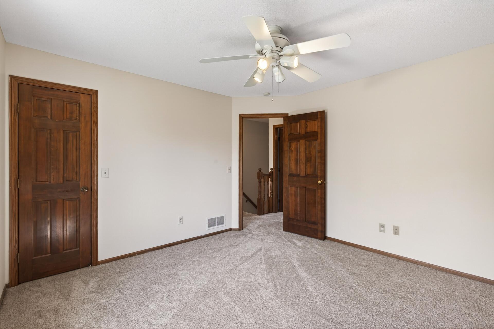 1 of 4 bedrooms on the upper level. This one features a walk-in closet.