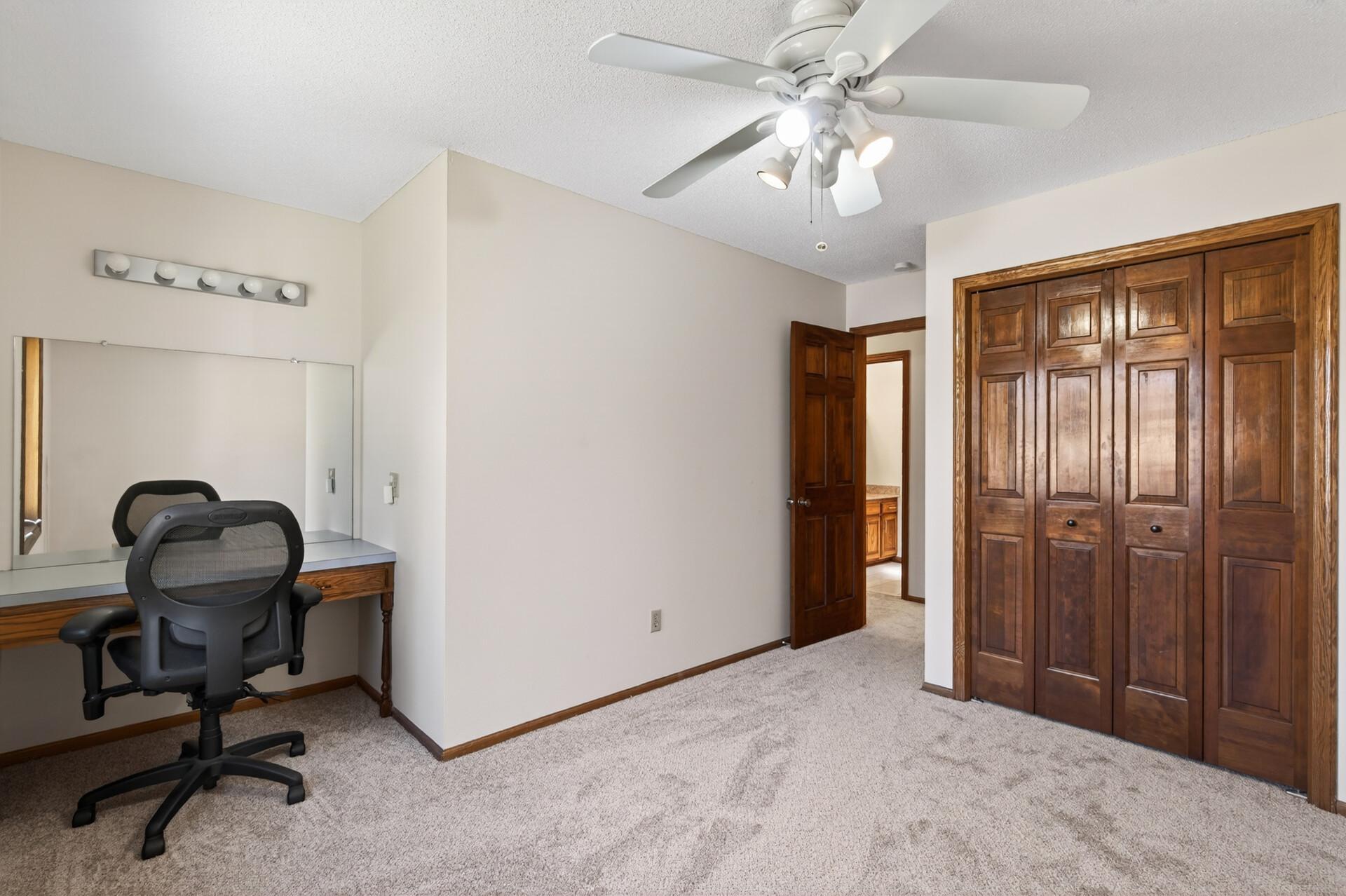 1 of 4 bedrooms on the upper level. This one features a built-in desk.