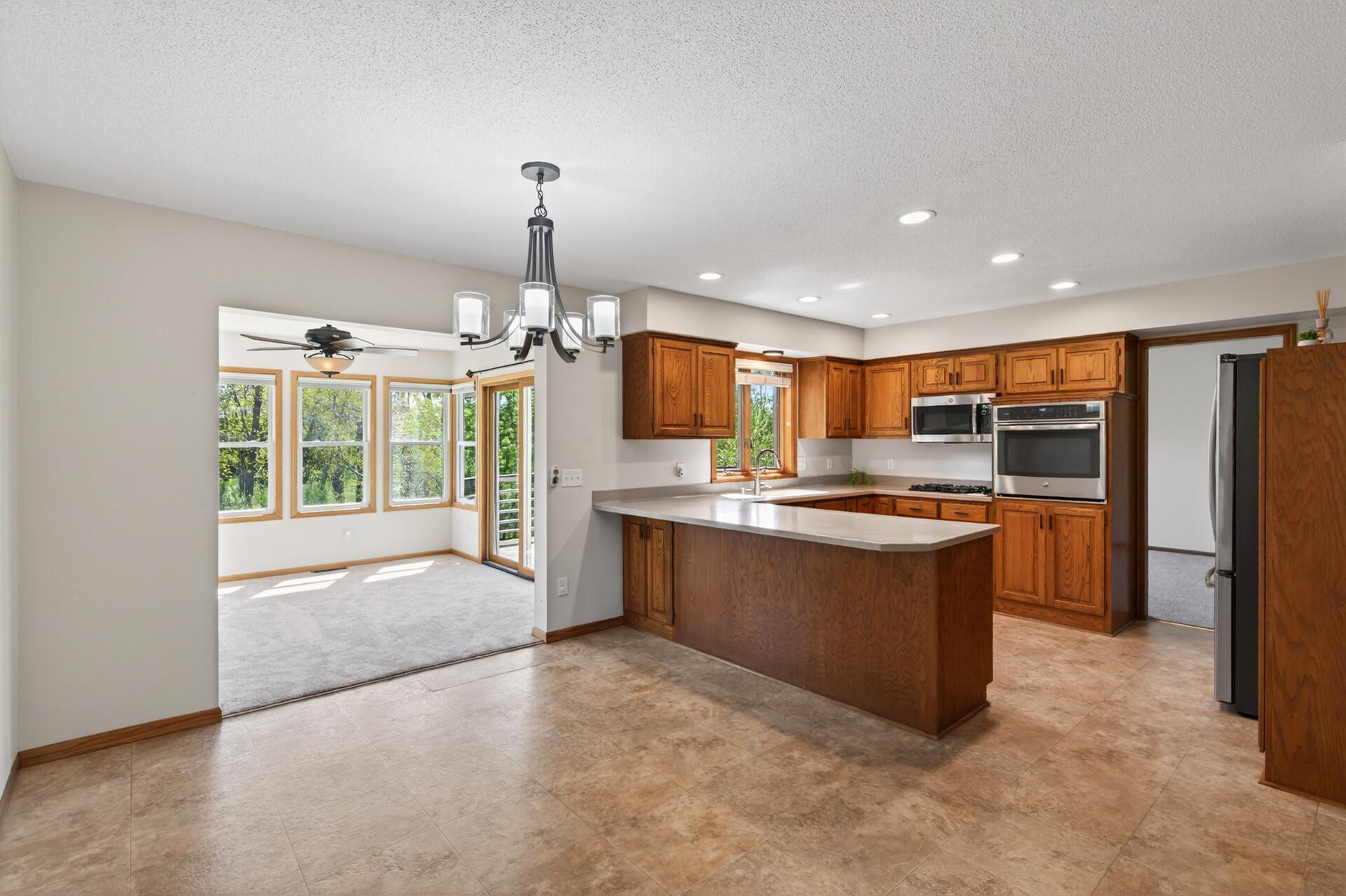 Spacious kitchen with plenty of cabinet space and SS appliances.