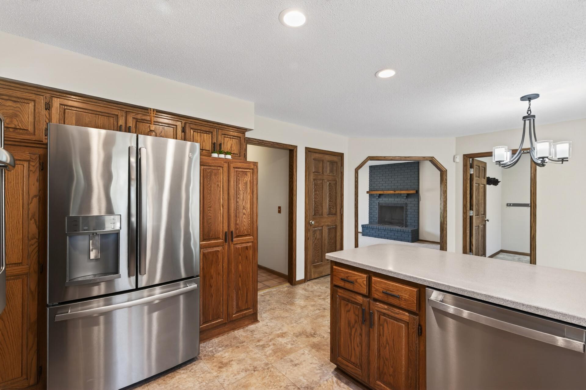 Spacious kitchen with plenty of cabinet space and SS appliances.
