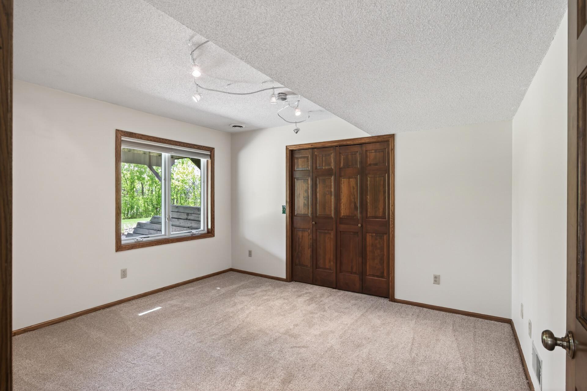 Bedroom 5 of the home is in the lower level with a HUGE closet!