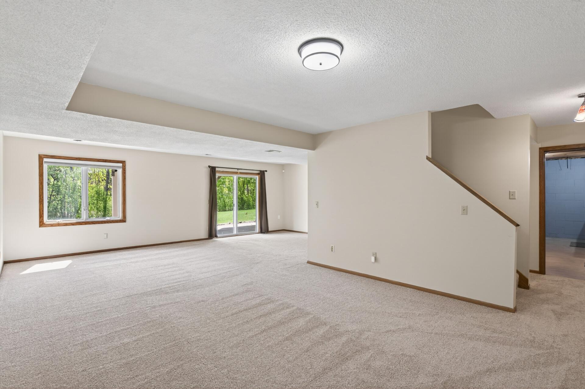 Walk-out basement leads to a concrete patio and backyard!