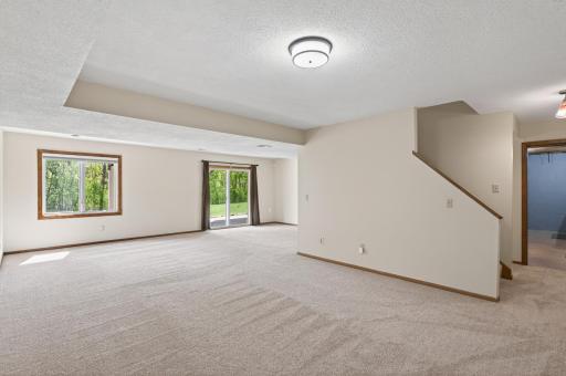 Walk-out basement leads to a concrete patio and backyard!