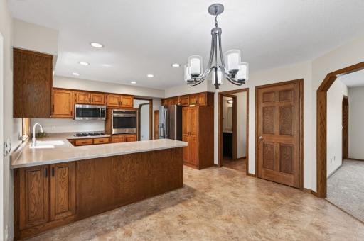Spacious kitchen with plenty of cabinet space and SS appliances.