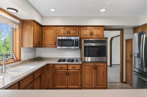 Spacious kitchen with plenty of cabinet space and SS appliances.