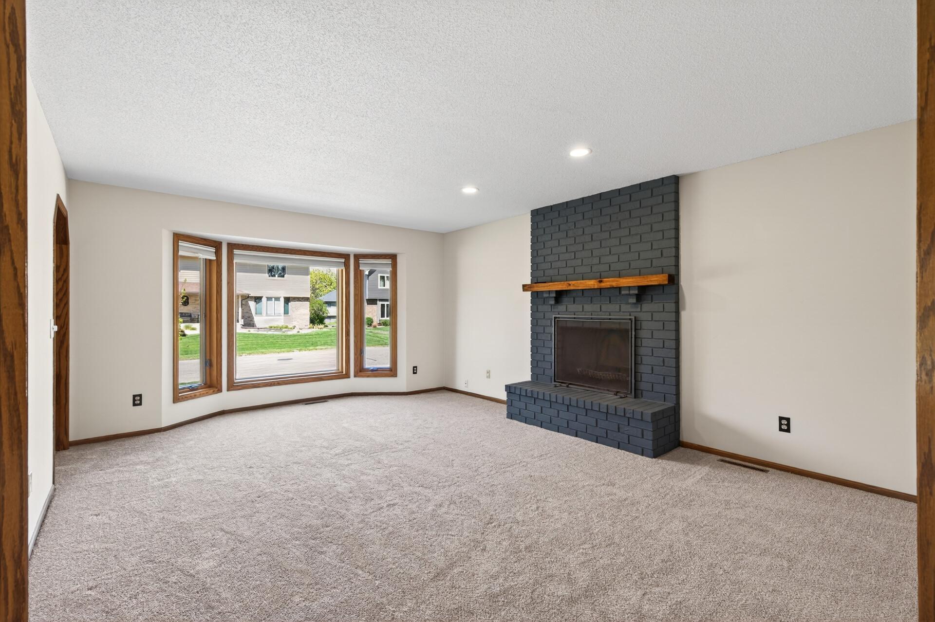 Wood-burning fireplace on main level.