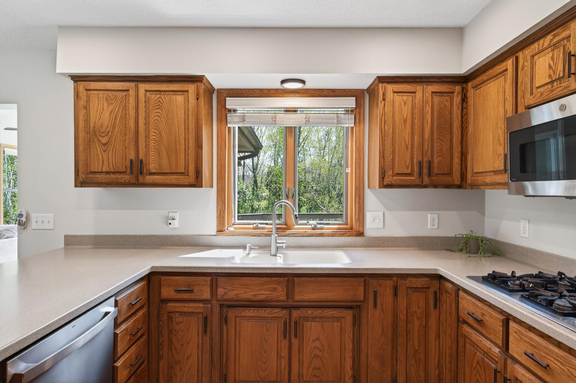 Spacious kitchen with plenty of cabinet space and SS appliances.