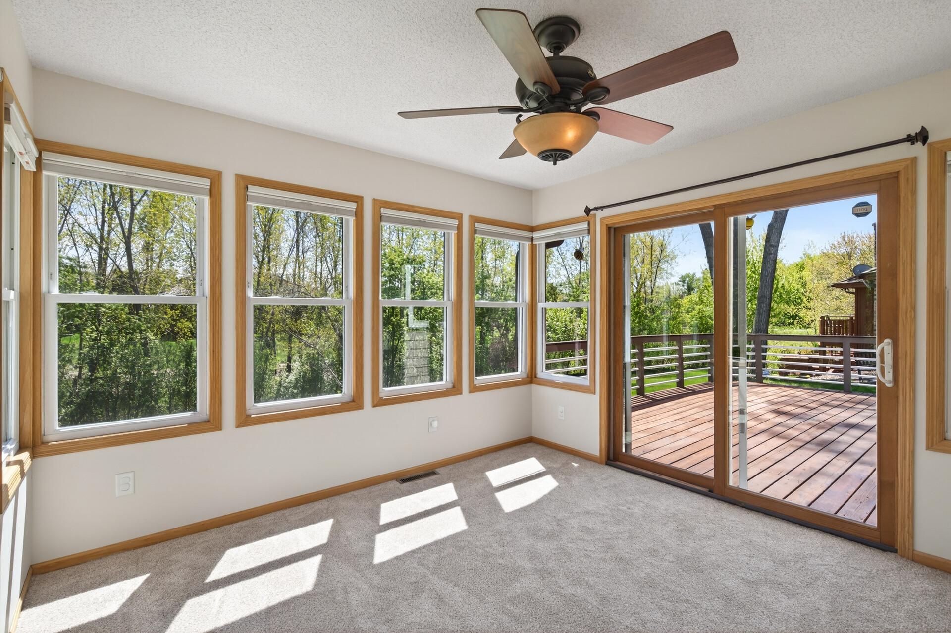 You will love sitting in this 4-season porch with panoramic views of the backyard!
